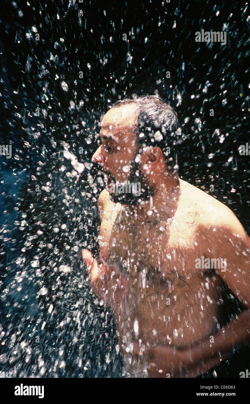 Man bathing in cold water at dalhousie himachal pradesh india Model Released Stock Photo