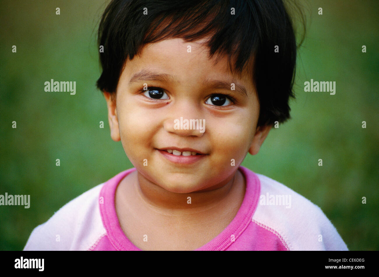small young baby girl loooking at camera   Model Released Stock Photo