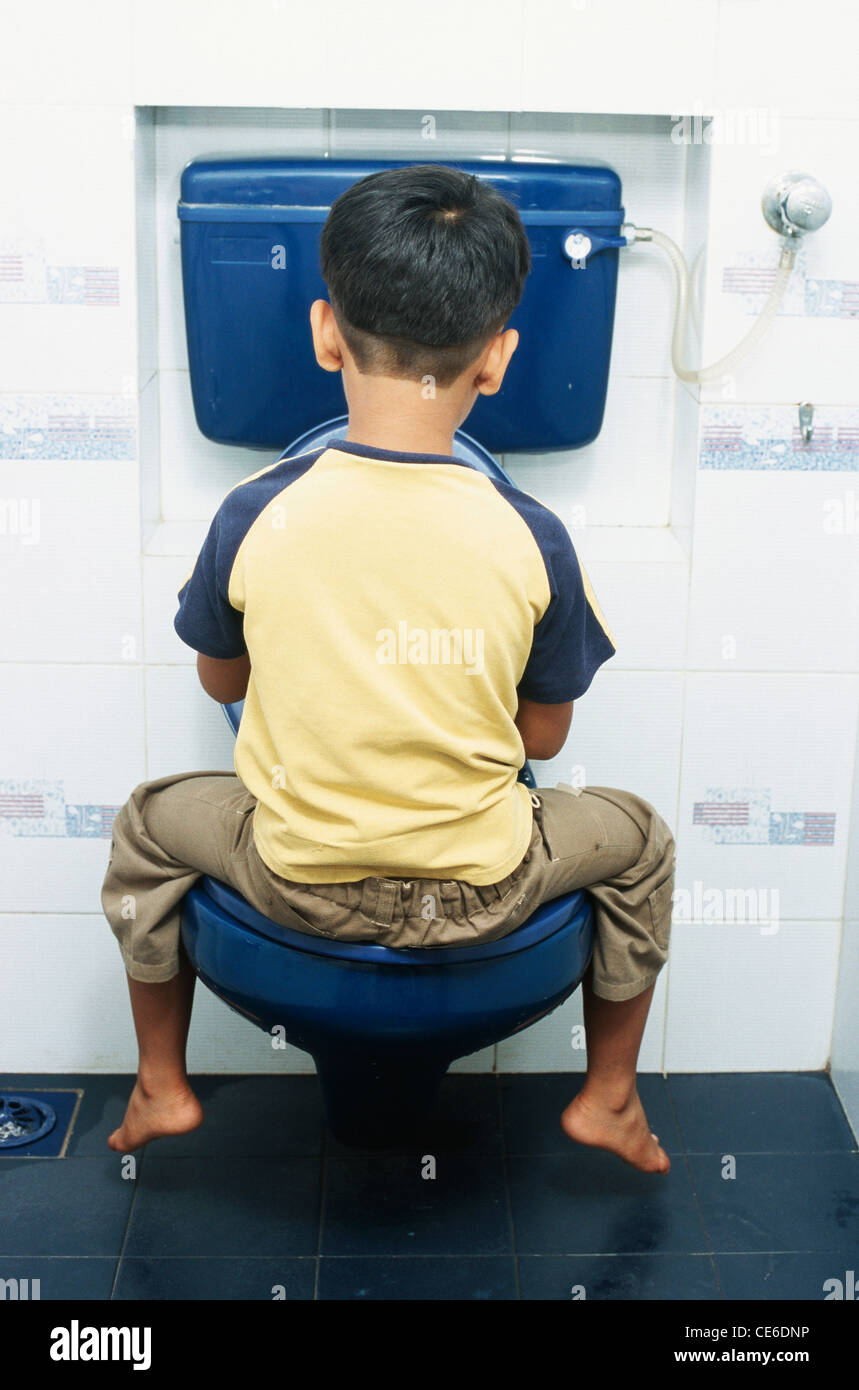 small young boy sitting on commode in toilet   MR#152 Stock Photo