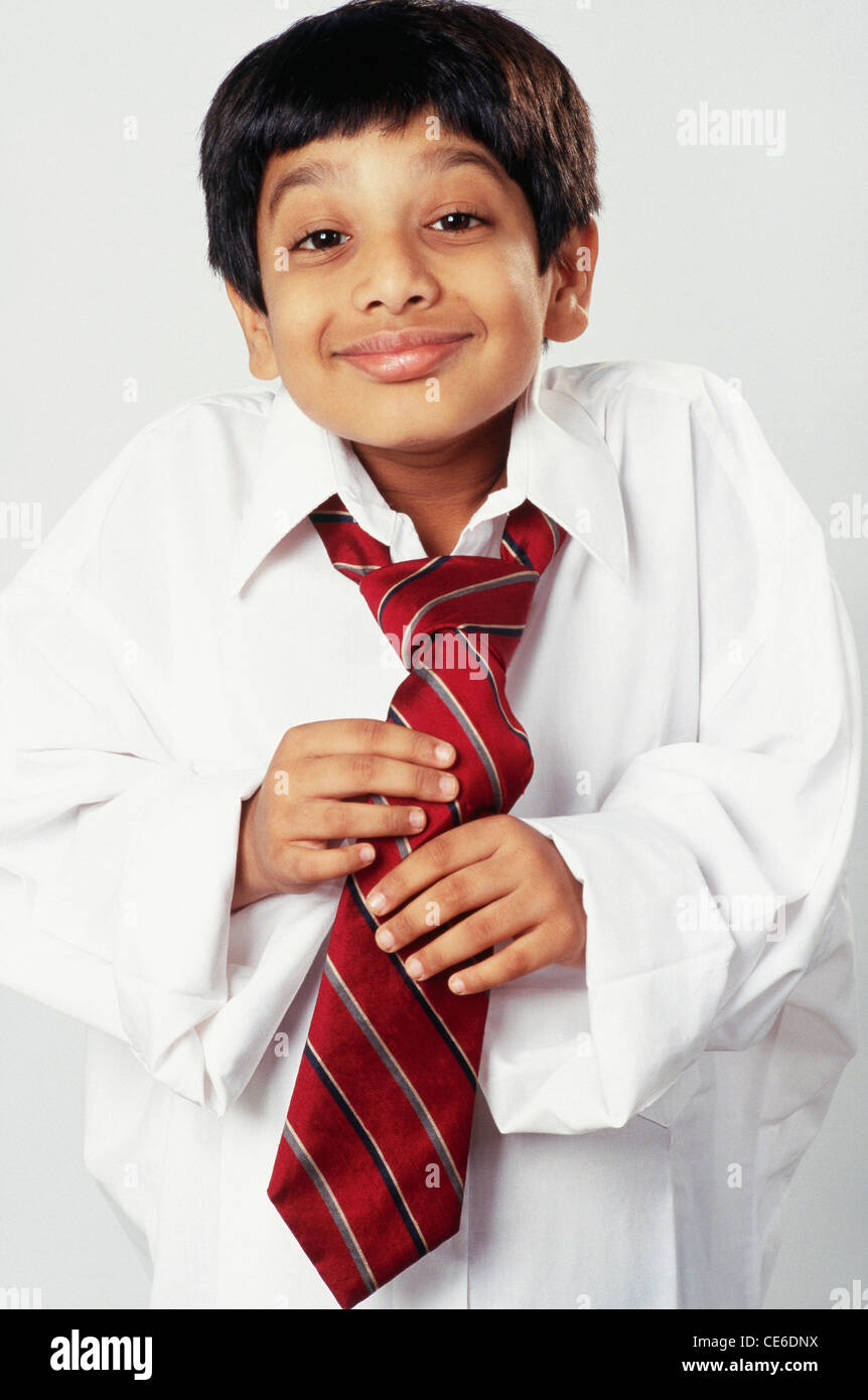 Premium Photo  Handsome indian young boy wearing white shirt and red tie