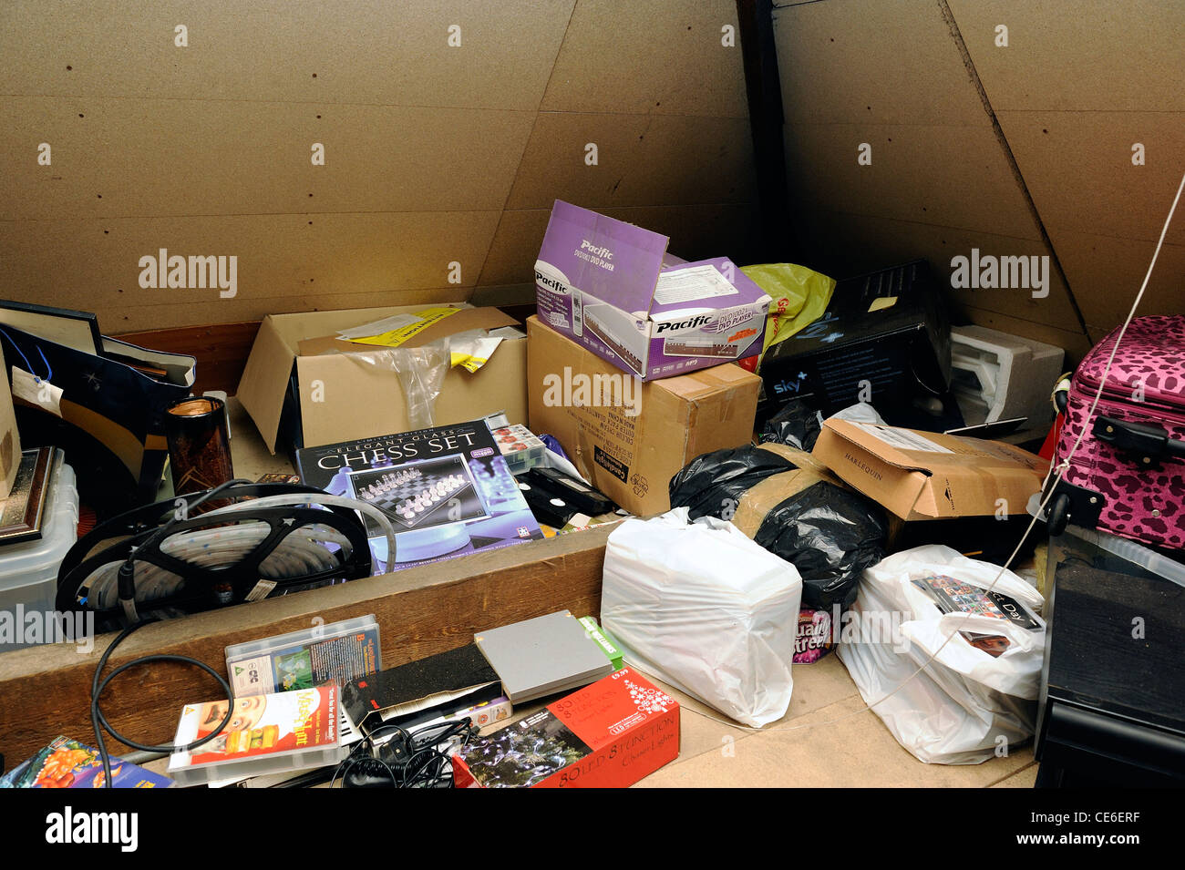 boxes and junk in an attic england uk Stock Photo Alamy