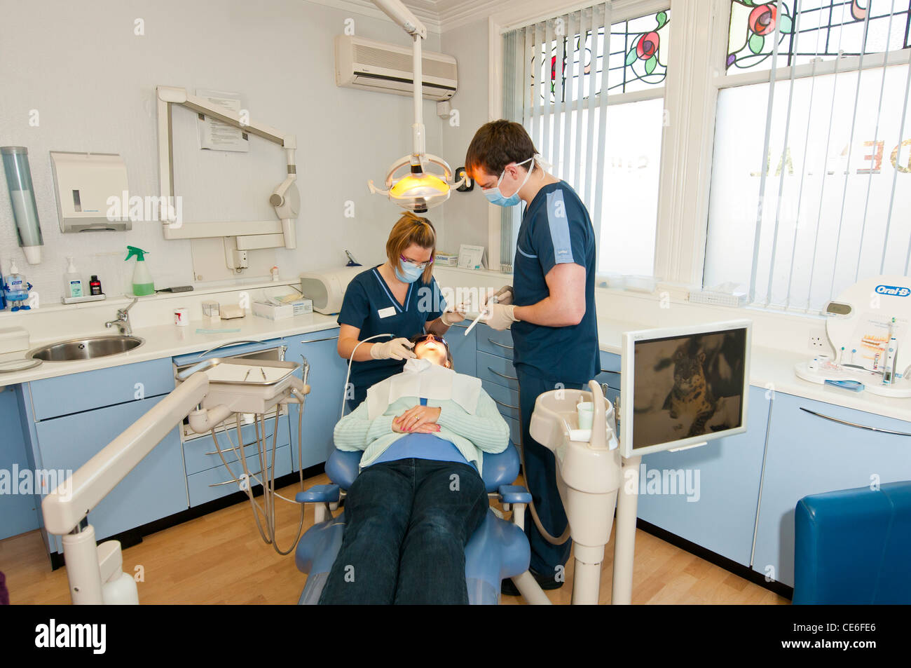 dental hygenist cleaning teeth chair dentist clean hygene checking check up female girl