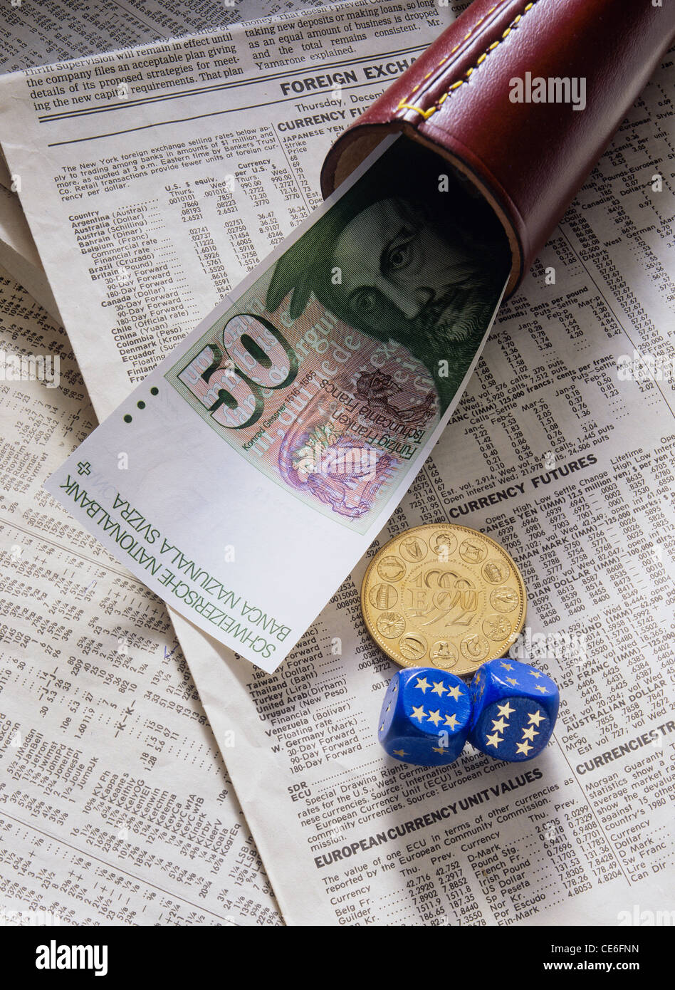 50 SWISS FRANCS BANKNOTE WITH 1 GOLD ECU - European Currency Unit - COIN  WITH SHAKER + 2 EUROPEAN DICE ON FINANCIAL NEWSPAPER Stock Photo - Alamy