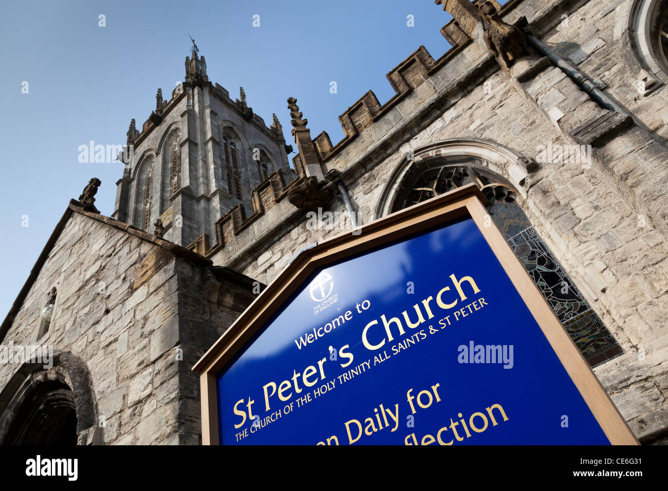 The notice board and front facade of St Peter's Church, Dorchester, Dorset, England. Stock Photo