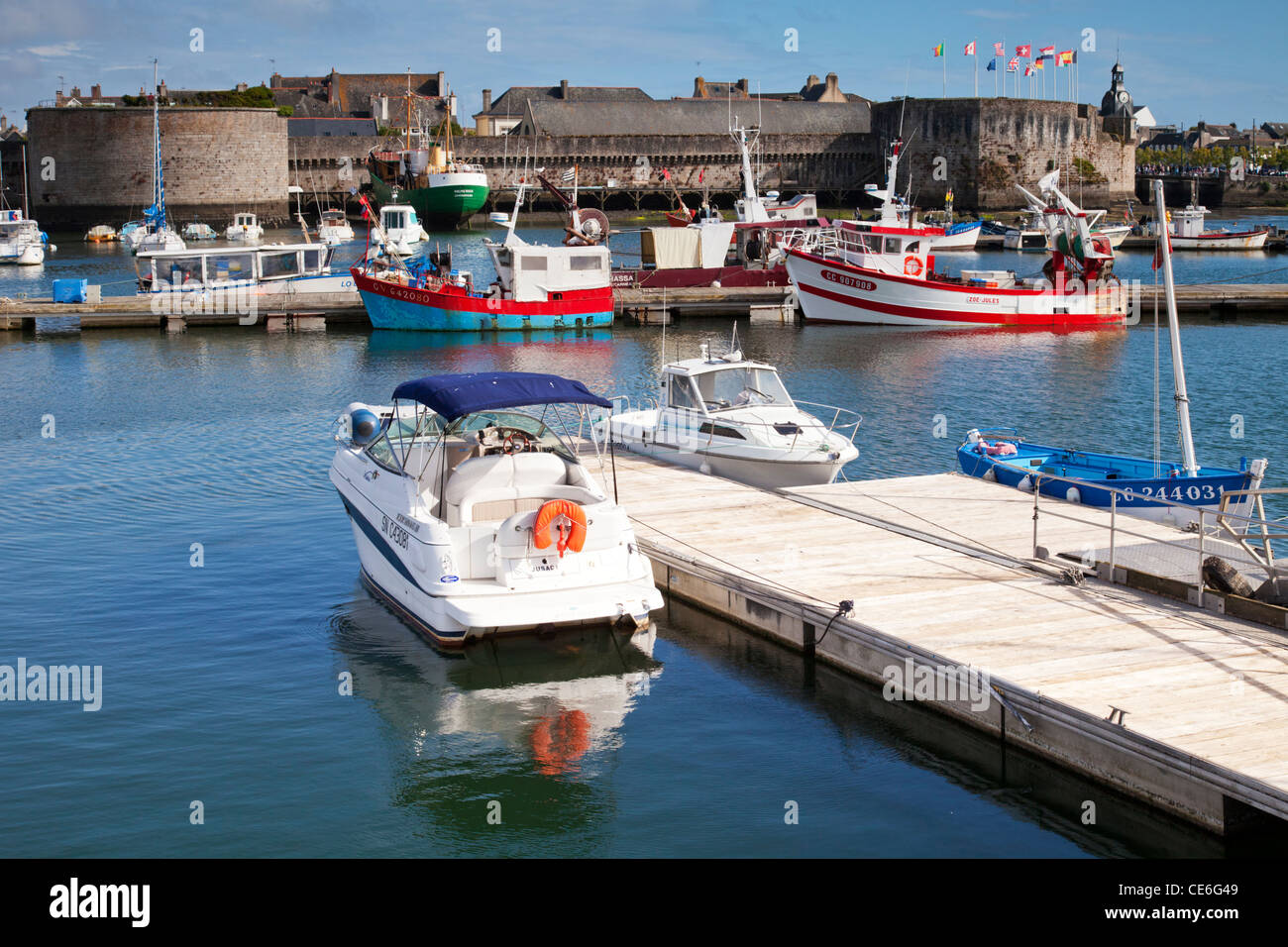 Fish boats and pleasure craft in the harbour at Concarneau, Brittany France. Concarneau is a major French fishing port. Stock Photo