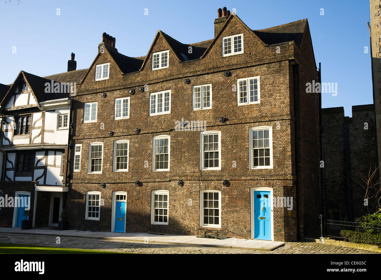 Old terrace / terraced houses  / housing / apartment / accommodation, close to Queen's House, at The Tower of London. UK. Stock Photo