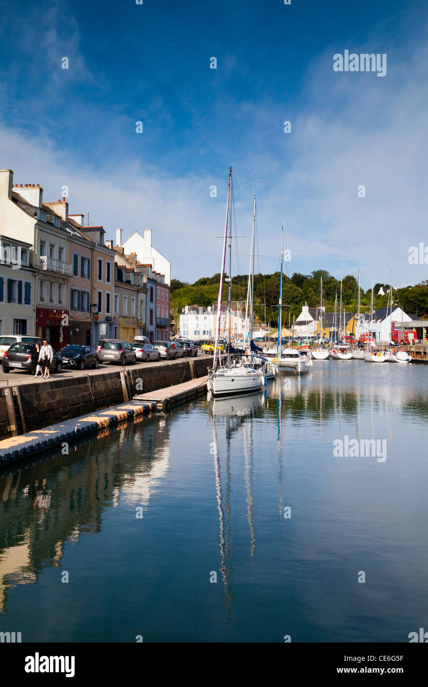 The quay and moored boats in the inner harbour of le Palais, on Belle Ile, Brittany. Stock Photo