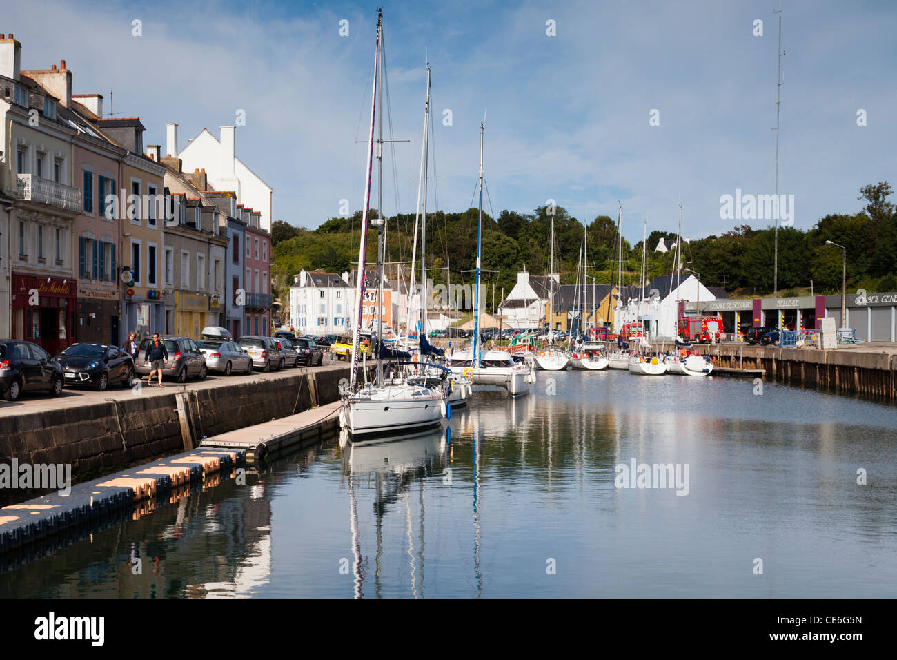 The quay and moored boats in the inner harbour of le Palais, on Belle Ile, Brittany. Stock Photo