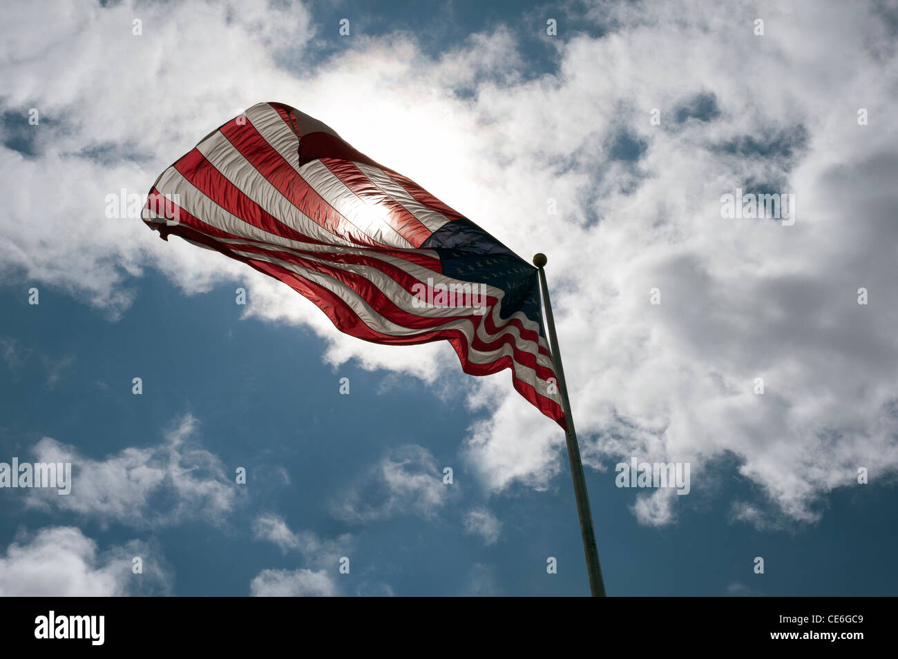 Cloudy sky and American Flag Stock Photo
