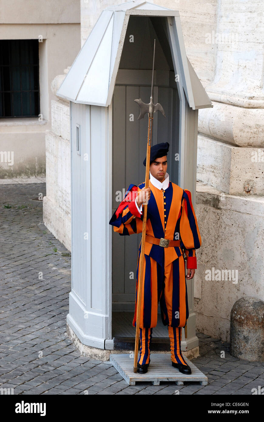 Swiss guardsman of the papal guard duty at the Saint Peters Basilica in the Vatican city in Rome. Stock Photo