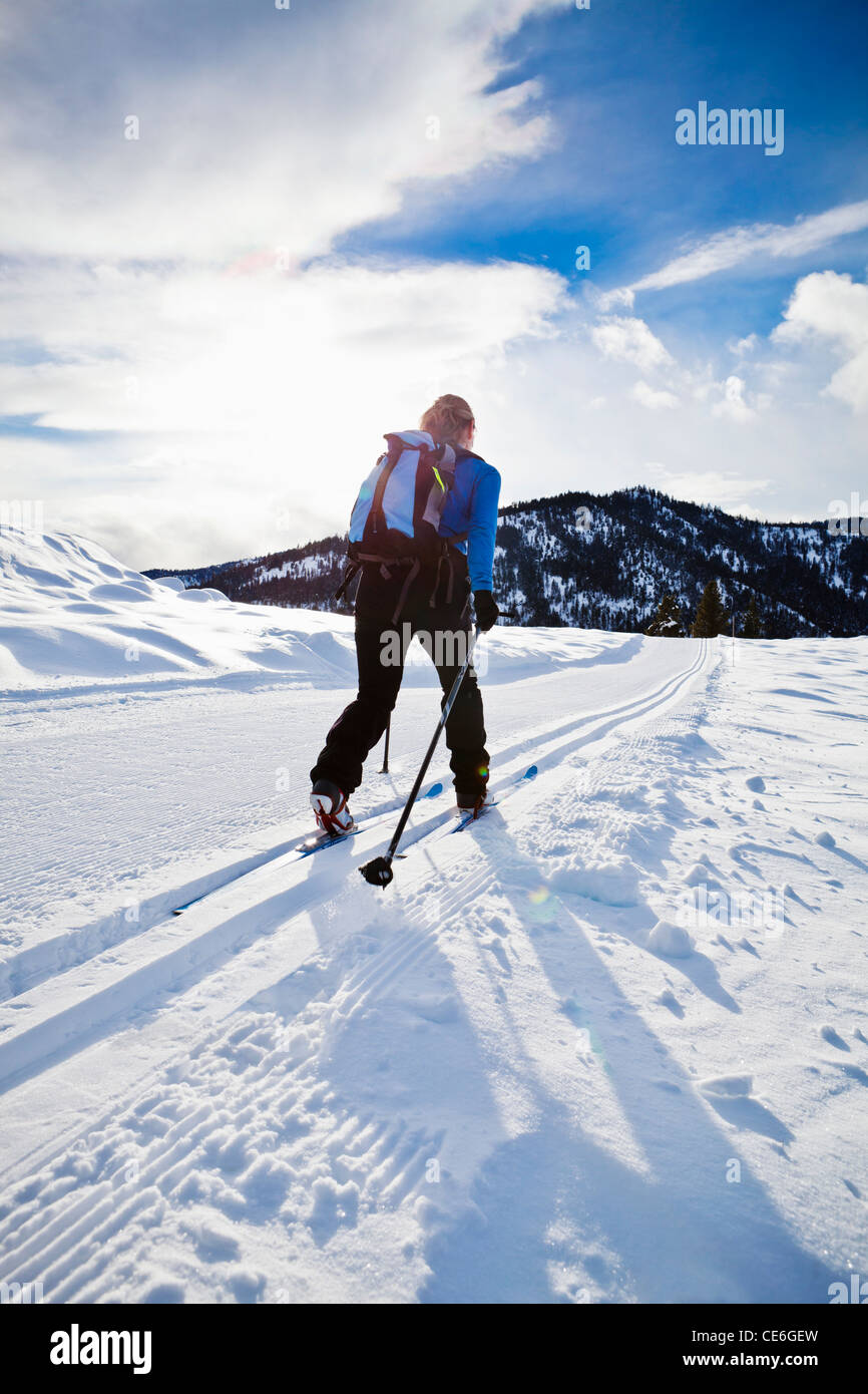 A woman cross country skiing on the Trails near Sun Mountain Lodge in the Methow valley, Washington, USA. Stock Photo