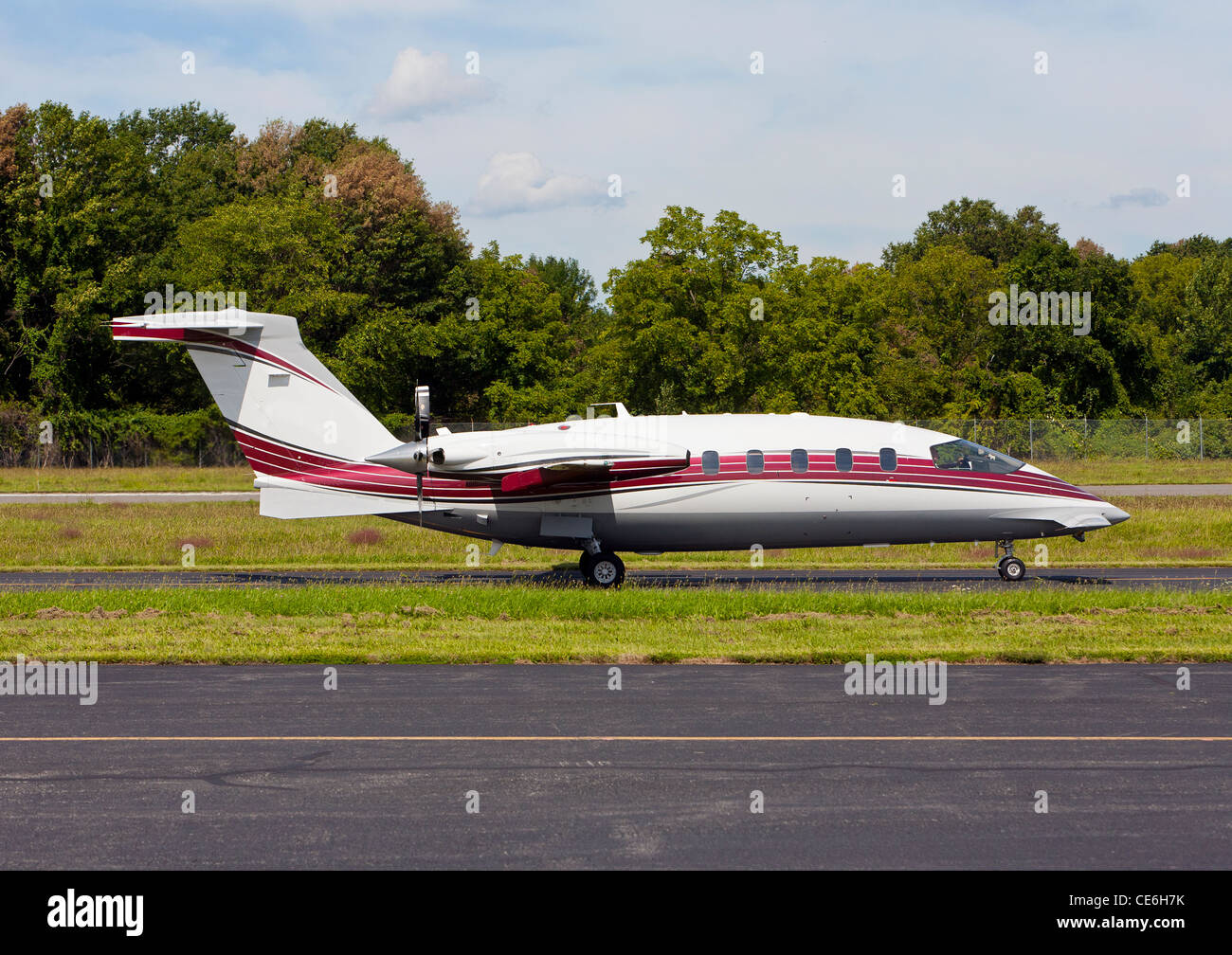 A Piaggio Aero Industries Spa plane taxing on the runway and getting ready for flight in the sky. Stock Photo