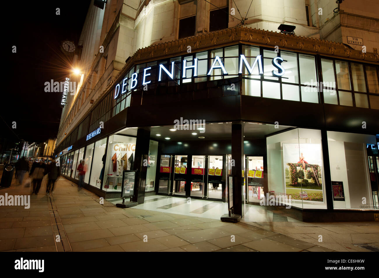 The storefront of the department store Debenhams on Market Street, Manchester, taken at night (Editorial use only). Stock Photo