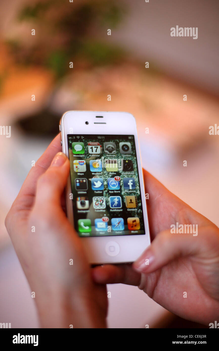 Person using twitter on a smart phone Stock Photo