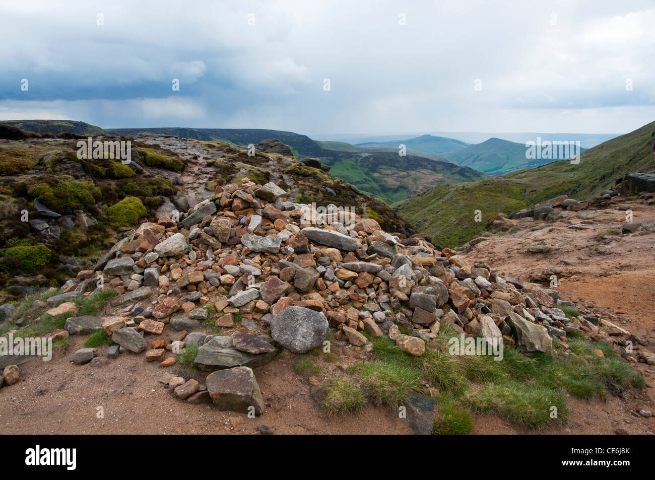 Storms approach Kinder Scout from the top of Grindsbrook Clough high above Edale in the Peak District National Park Stock Photo