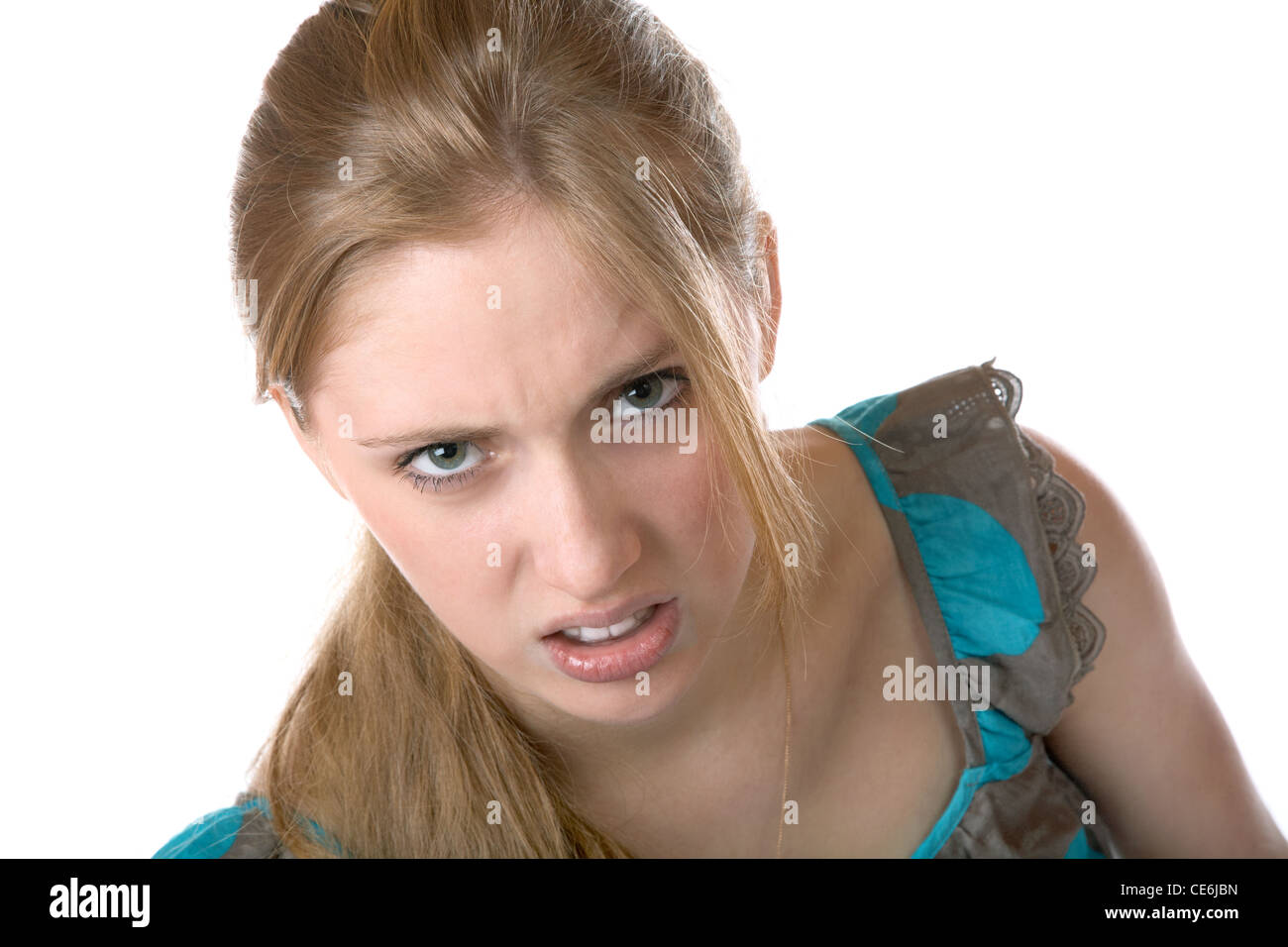 The girl shows discontent on a white background Stock Photo