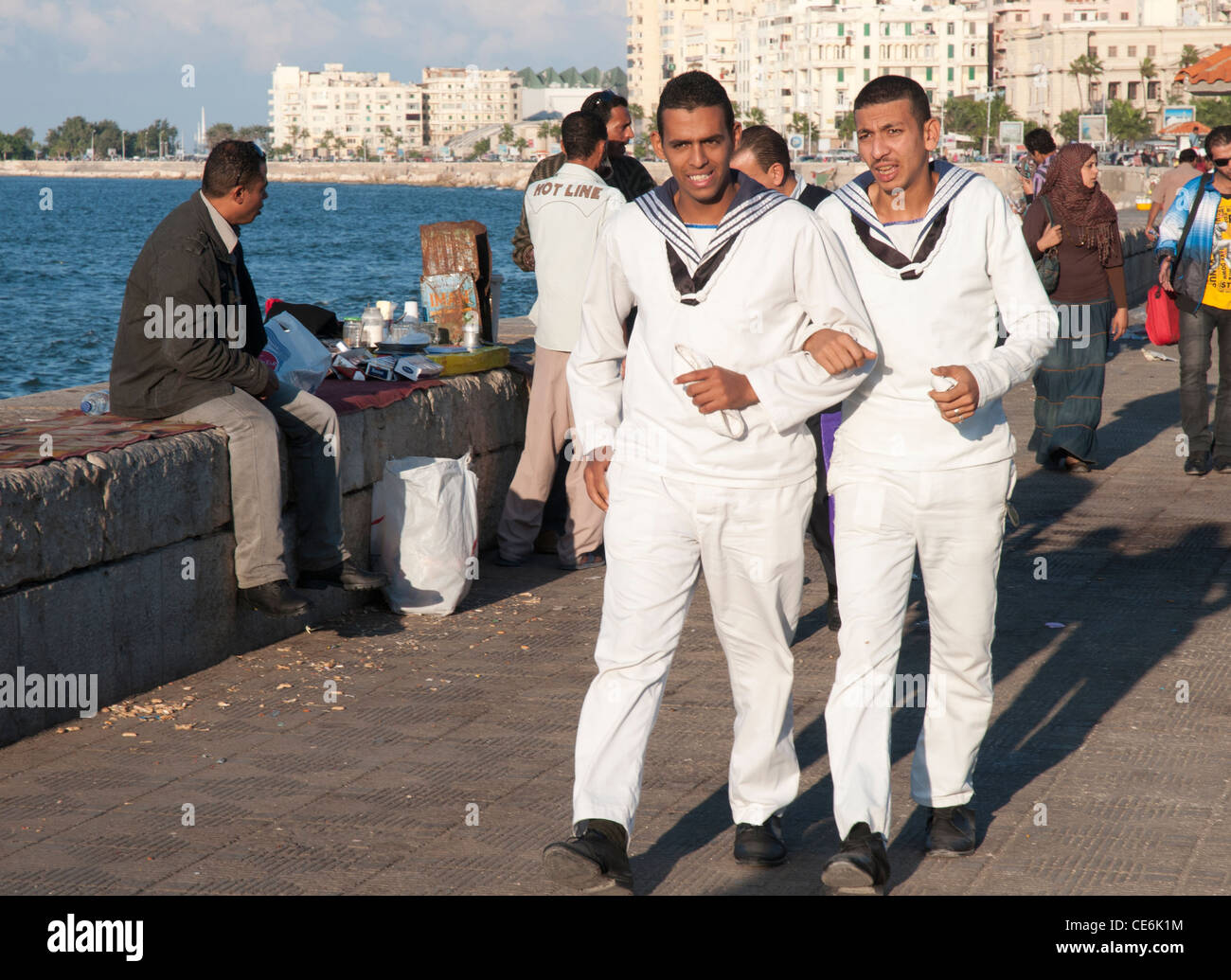 Egyptian sailors strolling on the Corniche in Alexandria Stock Photo