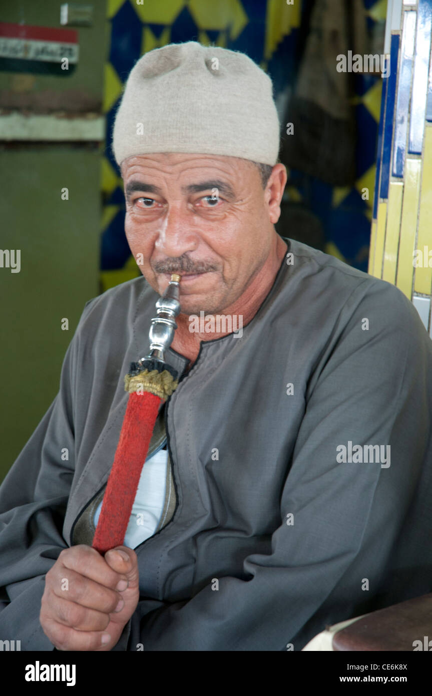 Egyptian man relaxing with narghile or bubble pipe Stock Photo
