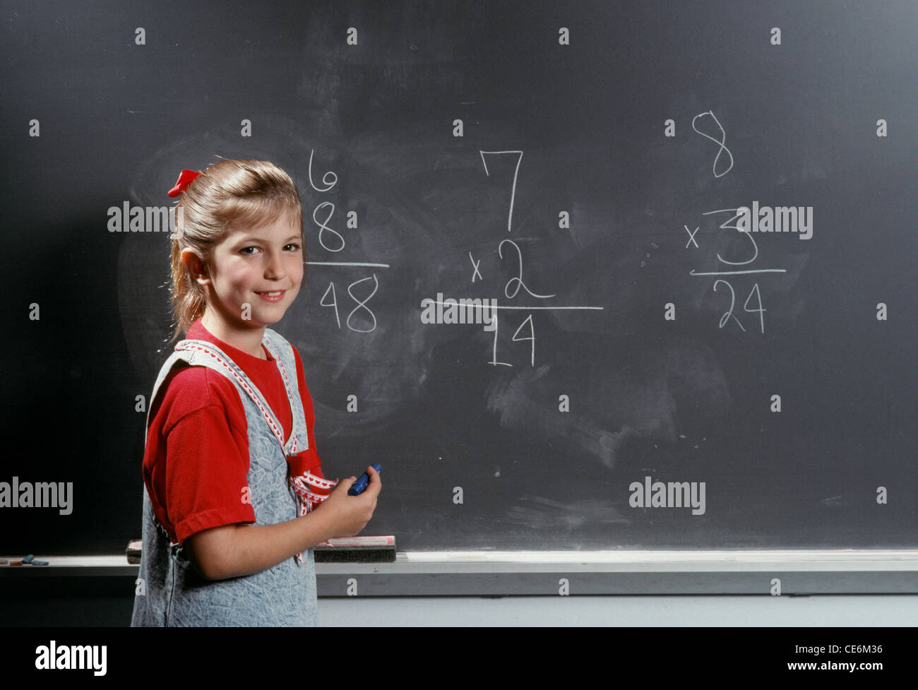 Young Schoolgirl At The Blackboard With Her Arithmetic Lesson1991 young-schoolgirl-at-the-blackboard-with-her-arithmetic-lesson1991
