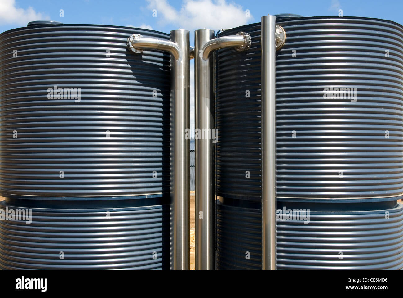 A pair of corrugated iron water tanks, complete with stainlesssteel