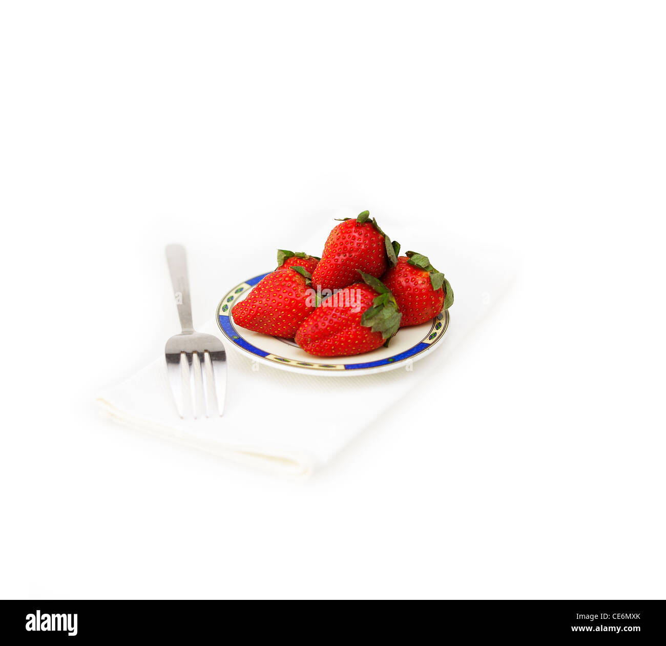 fresh strawberries on little dish isolated over white Stock Photo - Alamy