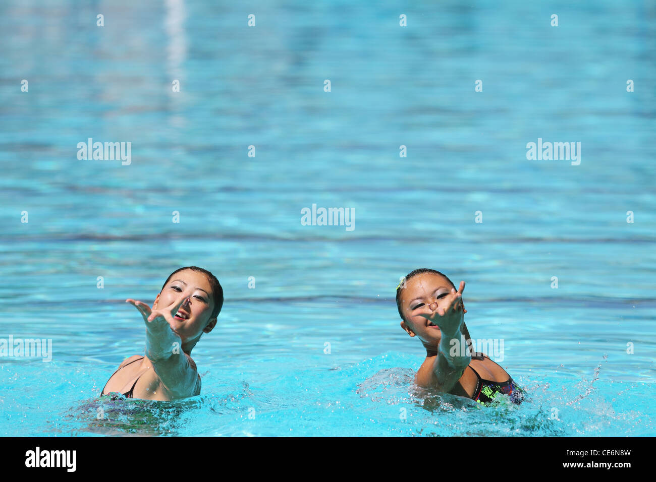 Synchronized Swimmers Performing in Swimming Pool Stock Photo - Alamy