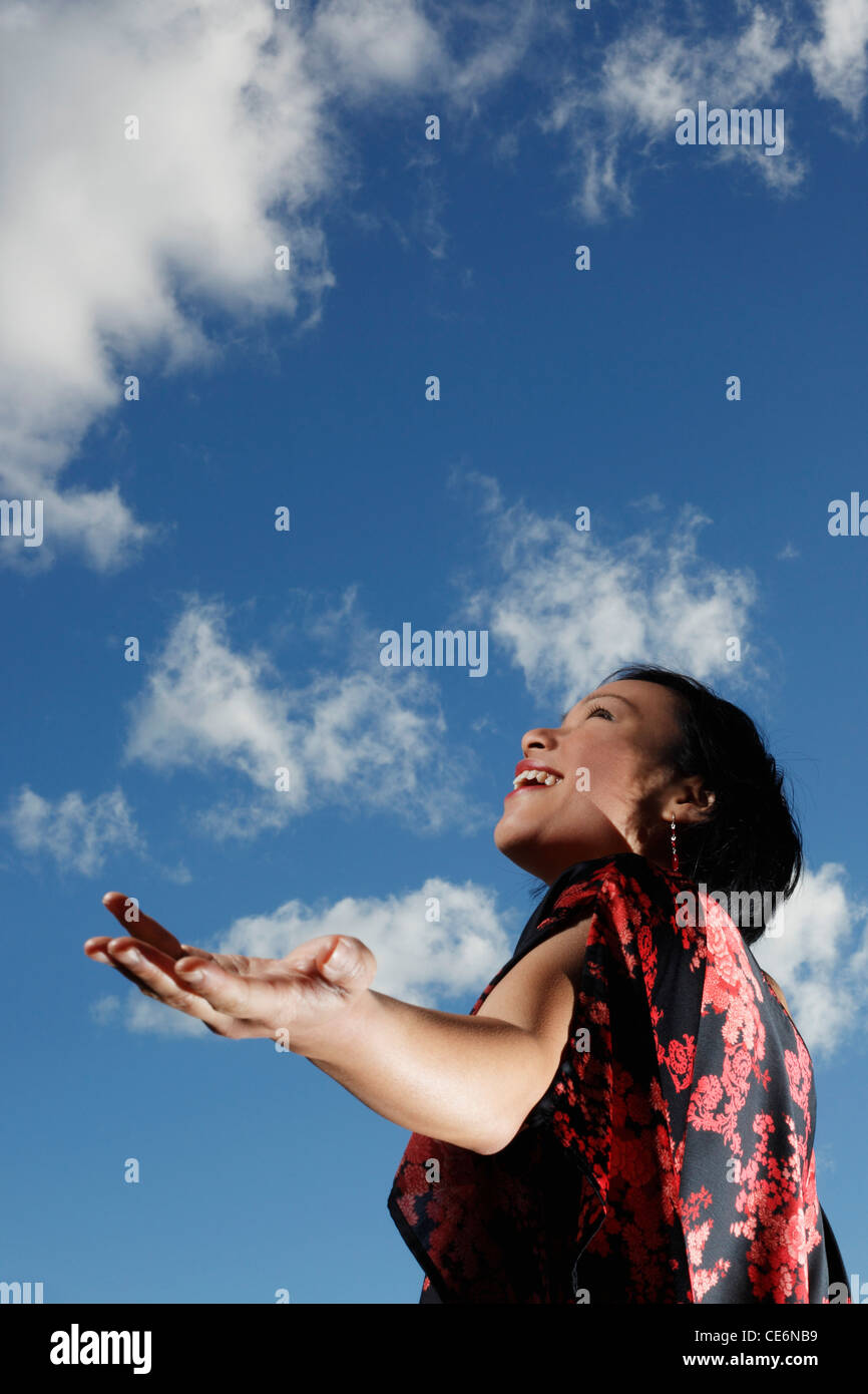 Woman looking up at sky hi-res stock photography and images - Alamy