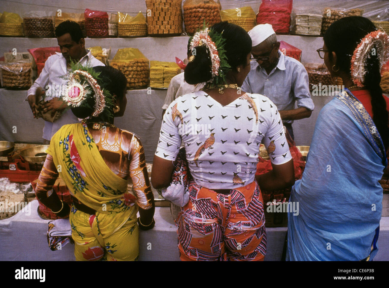 Koli women buying sweets versova mumbai maharashtra india Stock Photo
