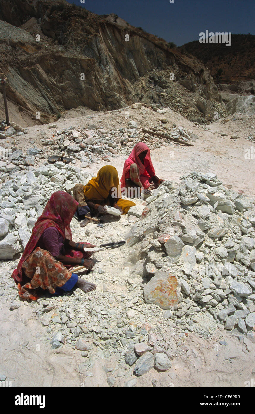 Indian women breaking working at soap stone mine ; udaipur ; rajasthan