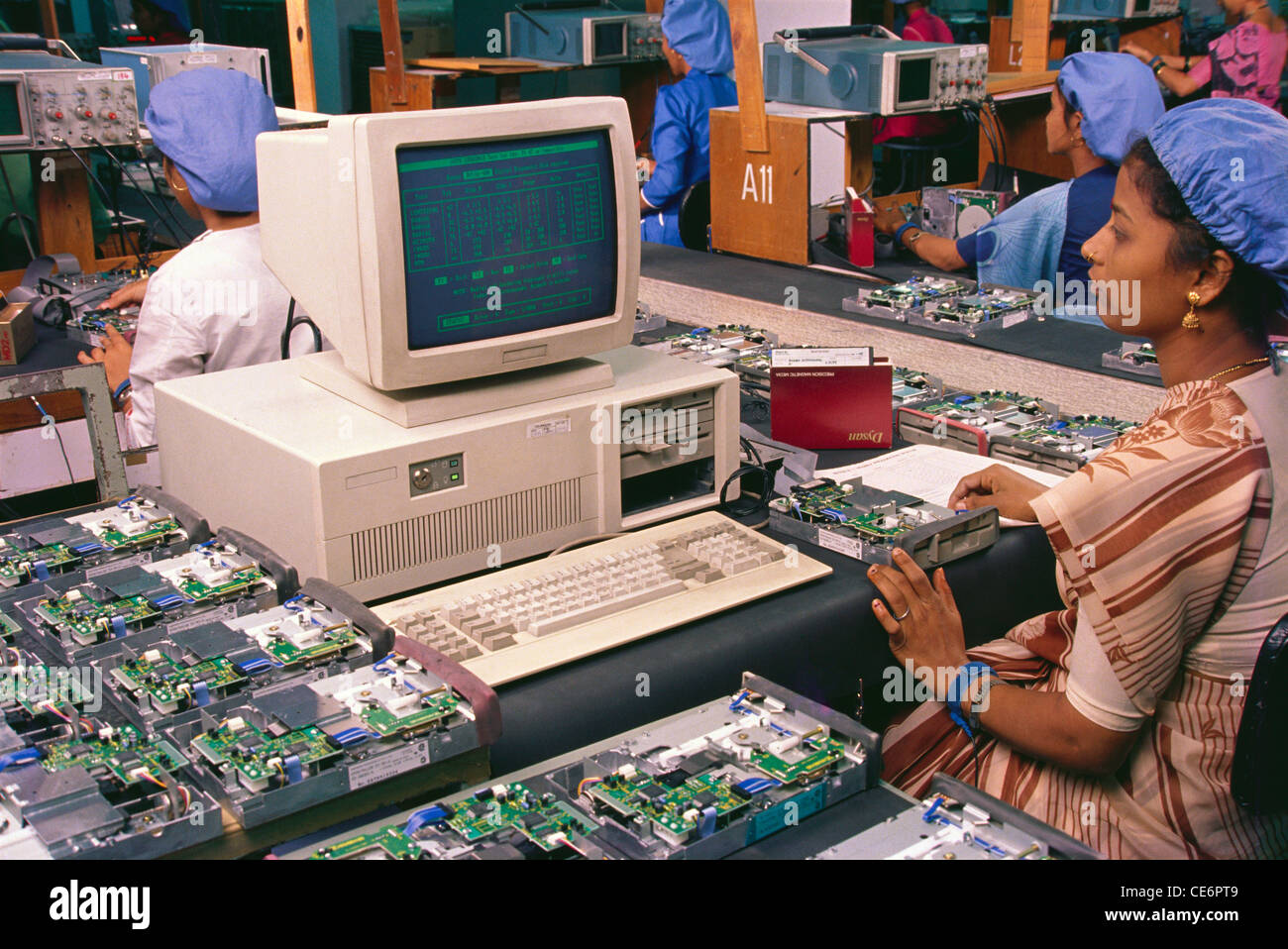 Indian women working in computer assembly factory ; india Stock Photo