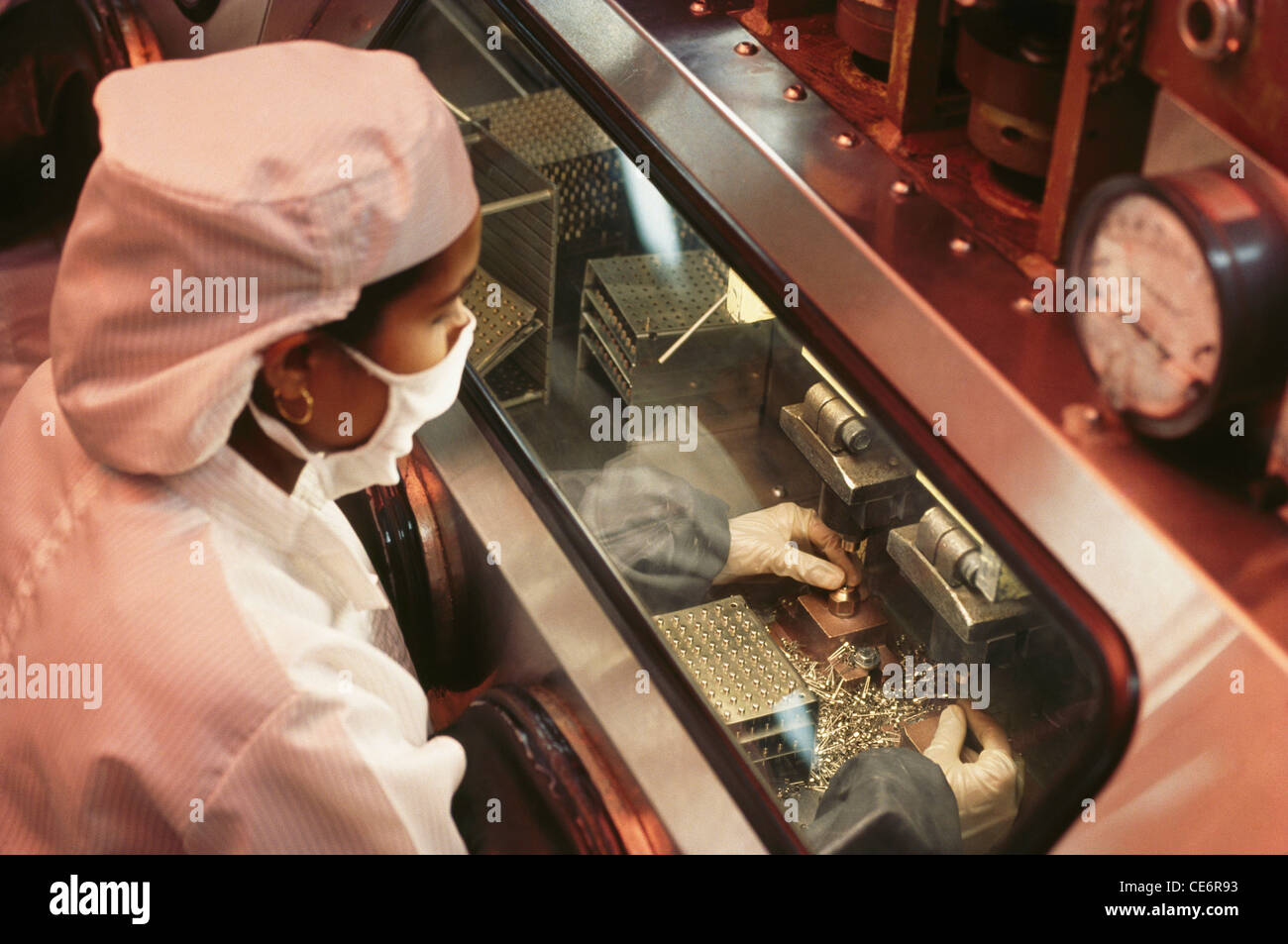 Woman working in electronic industry ; india Stock Photo