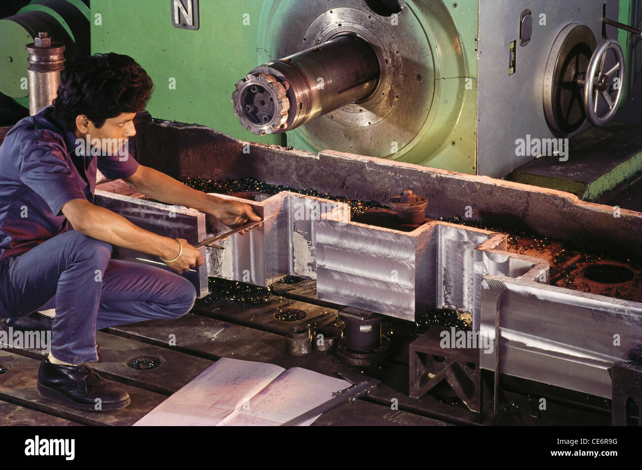 Indian man working in engineering factory ; india ; asia Stock Photo