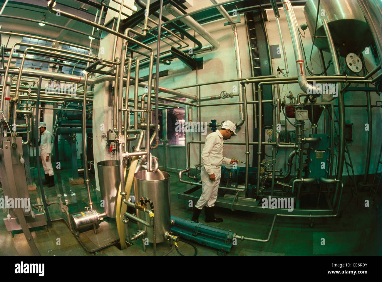 Indian man working in chemical factory ; chemical plant ; industrial process plant manufacture process chemicals ; india ; asia Stock Photo
