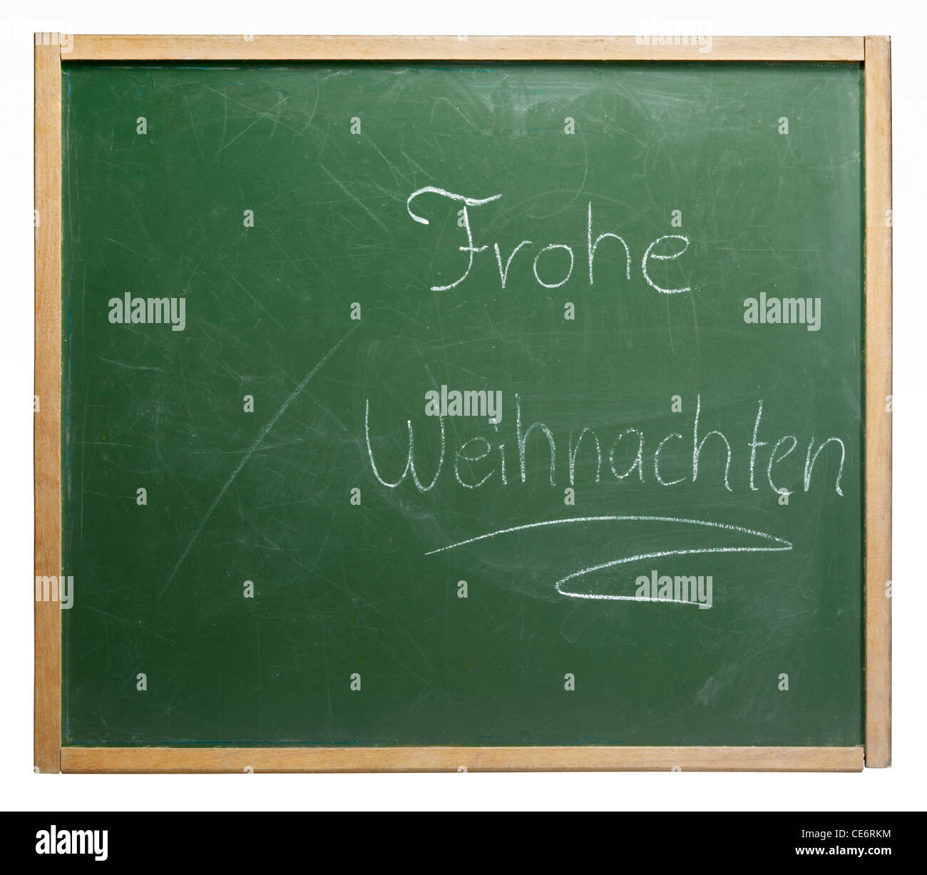 old used blackboard with written 'Frohe Weihnachten' on it. Studio photography in white back Stock Photo