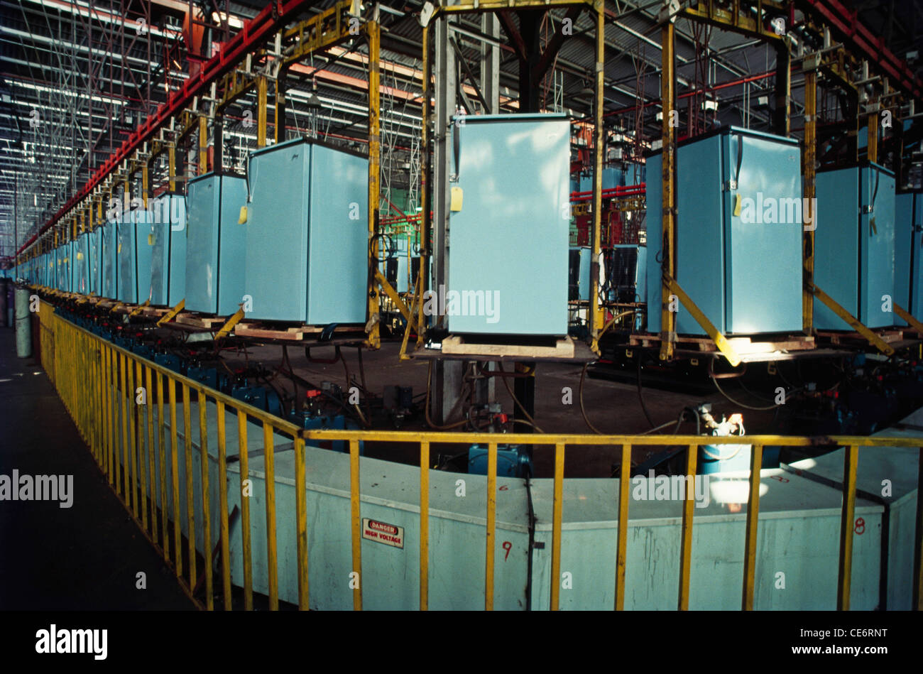Refrigerator manufacturing moving on conveyor belt factory industry plant india Stock Photo