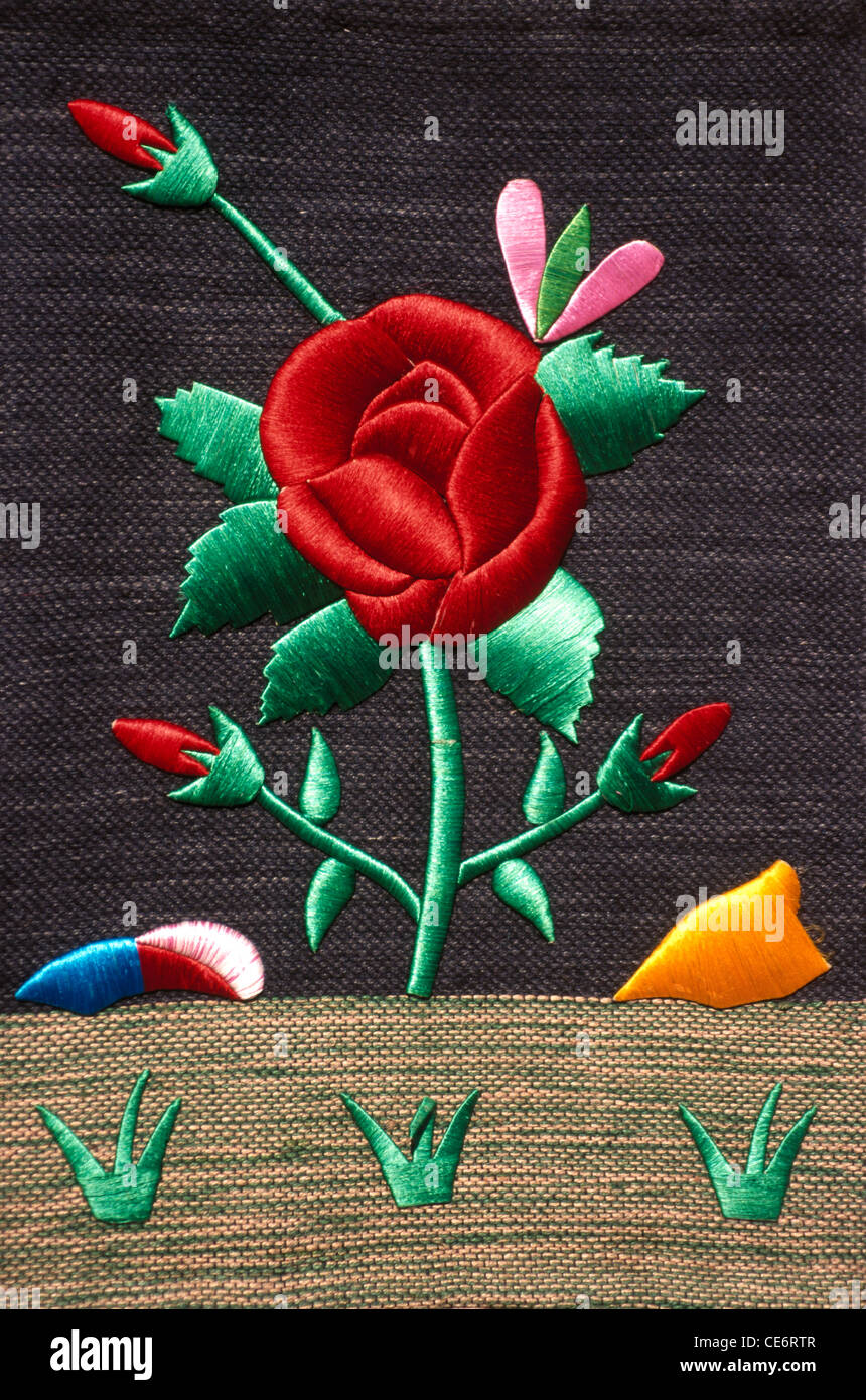 BDR 85069 : embroidery on cloth of red rose green leaf handicrafts india Stock Photo