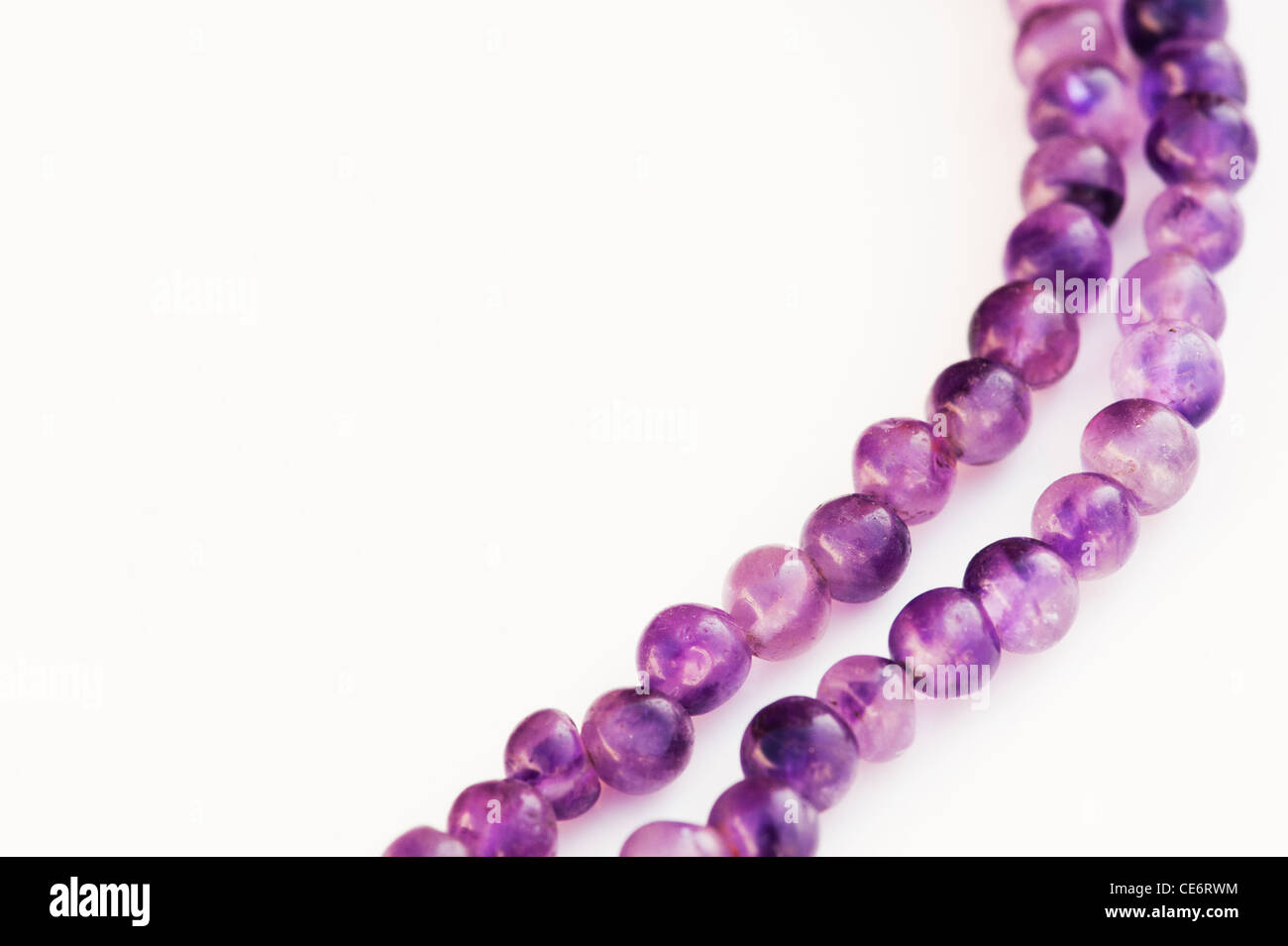 Amethyst Japa Mala prayer beads on white background Stock Photo