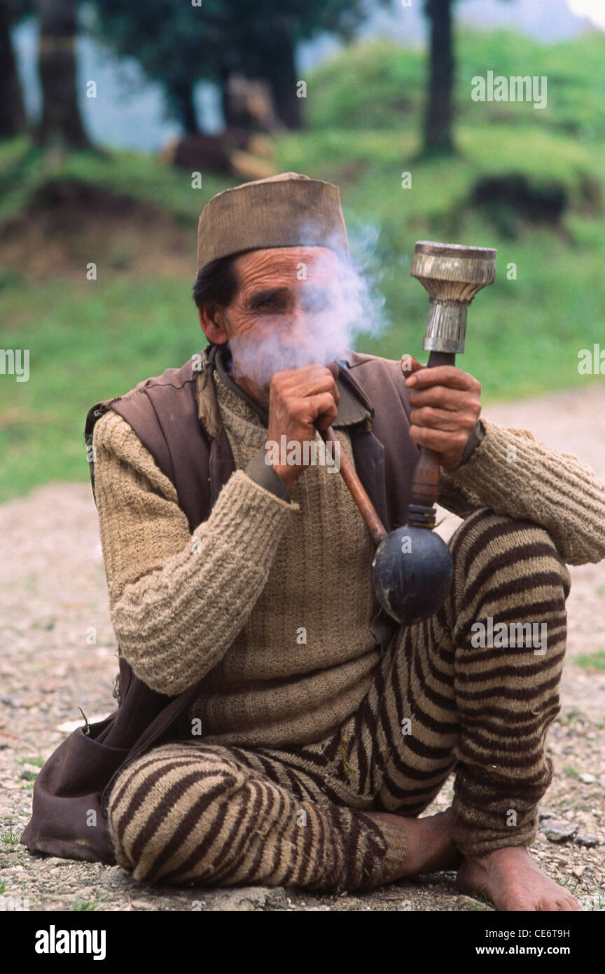 SSK 85885 : garhwali man sitting smoking puffing hookah garhwal uttaranchal uttarakhand india Stock Photo