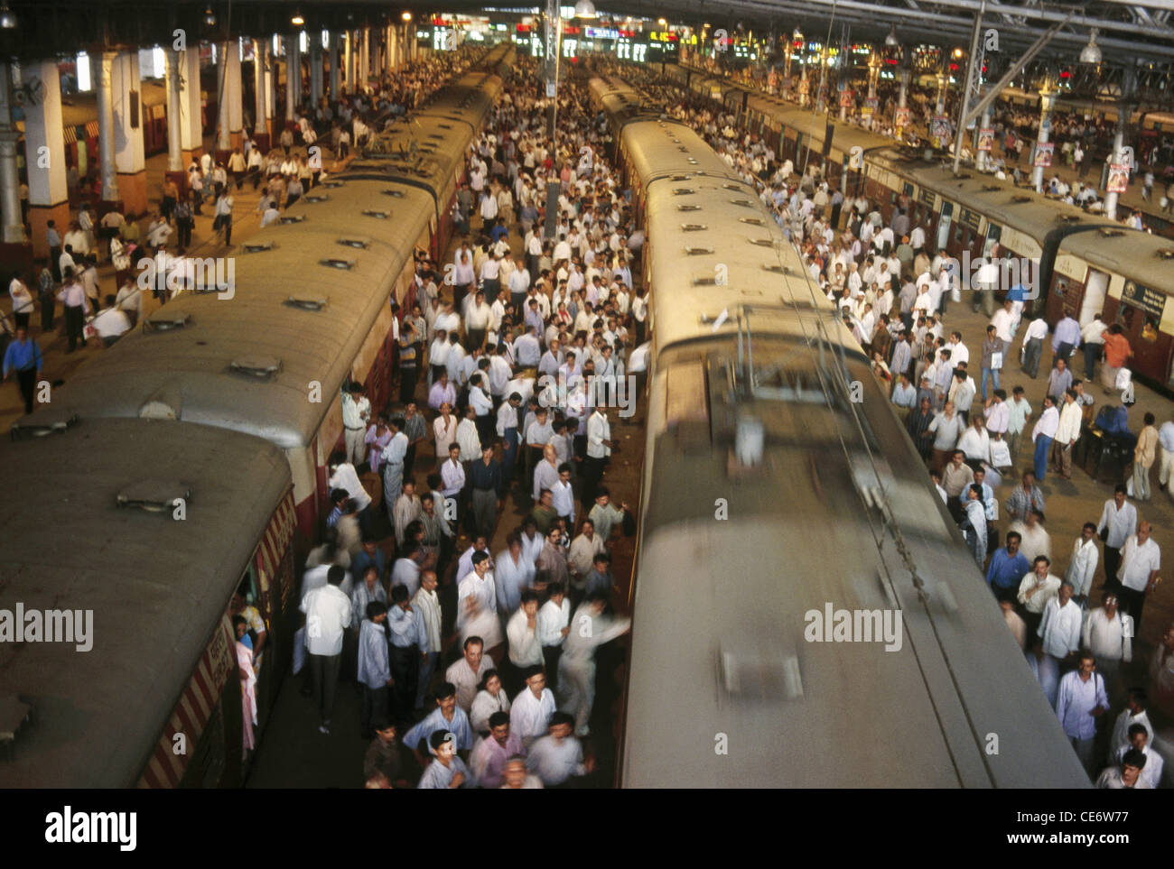Crowd at local train Chatrapati Shivaji Terminus Mumbai Bombay Maharashtra India Indian railway station train terminus Stock Photo