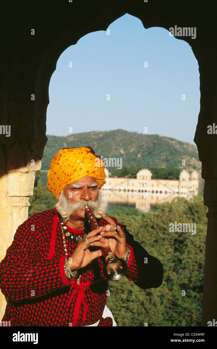 Indian rajasthani folk musician playing wind musical instrument shehnai jaipur rajasthan india