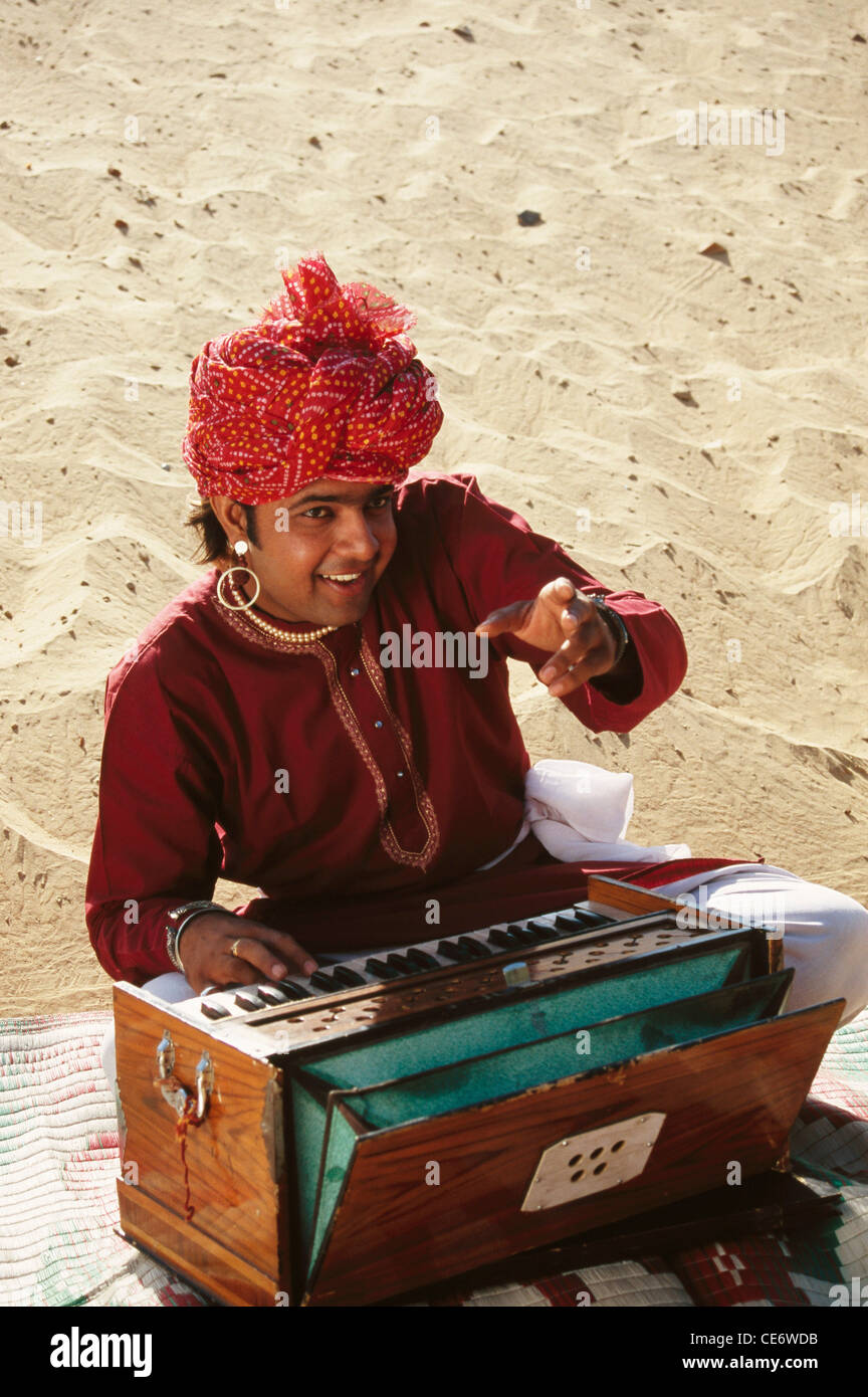 BDR 83380 : indian rajasthani folk musician singing and playing musical instrument harmonium rajasthan india MR#657B Stock Photo