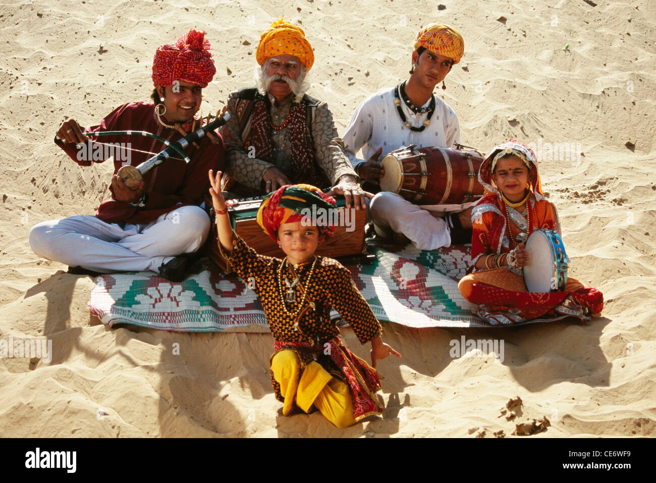 BDR 83397 : rajasthani folk musicians dancing and playing harmonium violin drums rajasthan india MR#657A Stock Photo