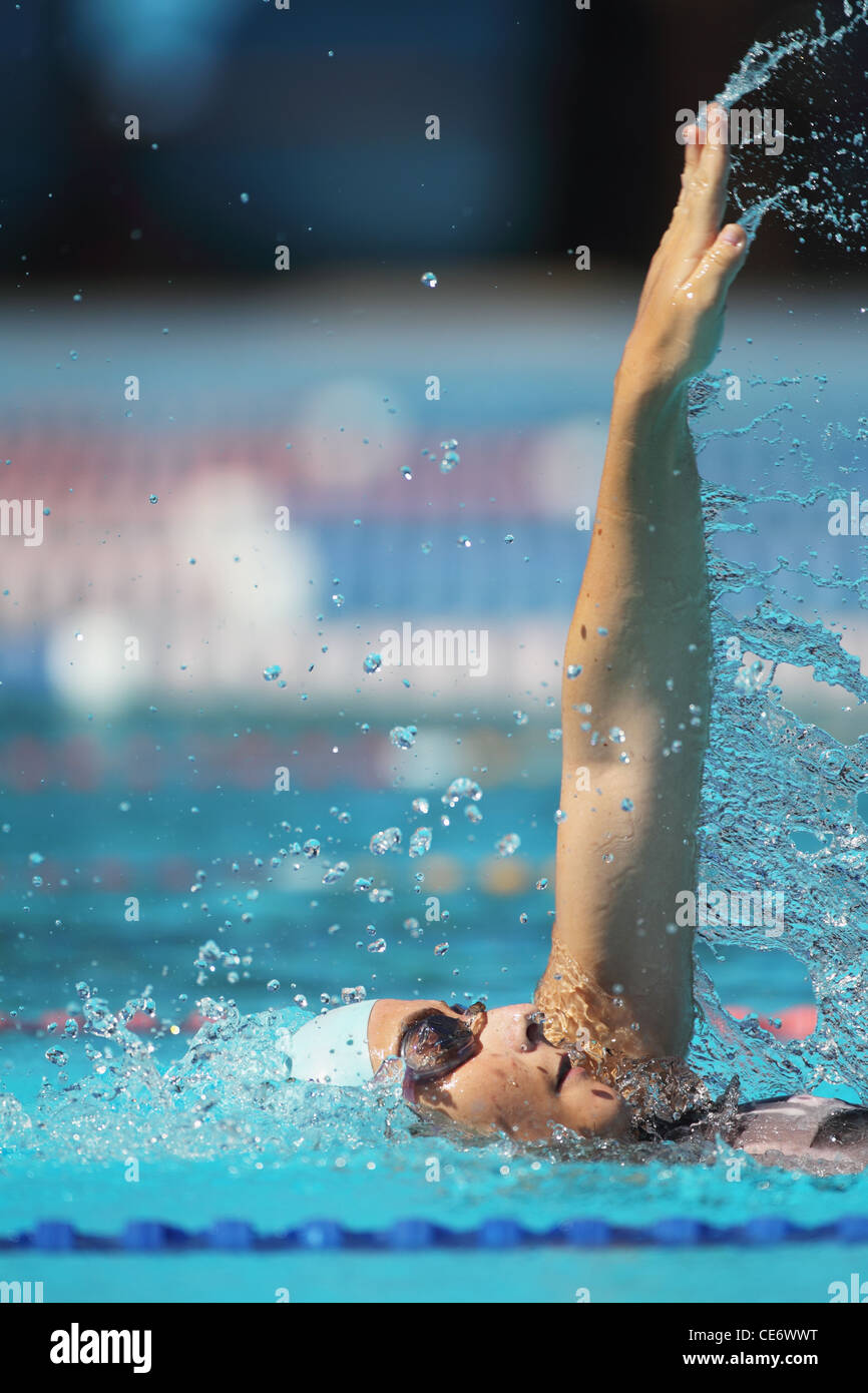 Young woman swimming backstroke hi-res stock photography and images - Alamy
