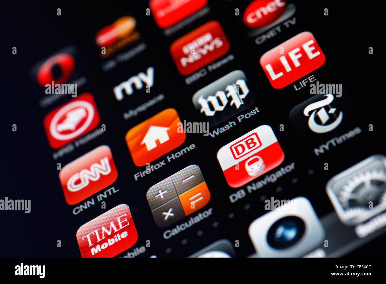 Muenster, Germany, January 26, 2012: Image of the iphone touch screen. Display shows a collection of useful apps with red color Stock Photo