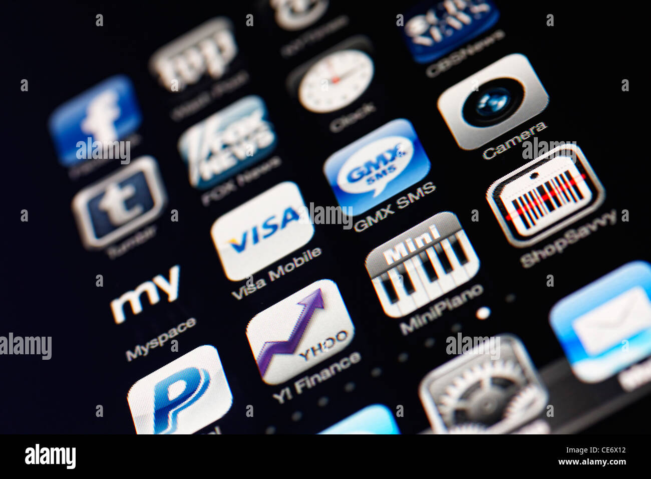 Muenster, Germany, January 26, 2012: Image of the iphone touch screen. Display shows a collection of useful apps with blue and g Stock Photo