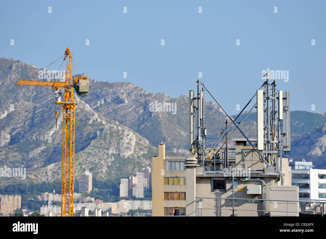 Cell phone antennas on building roof, Marseille, France Stock Photo