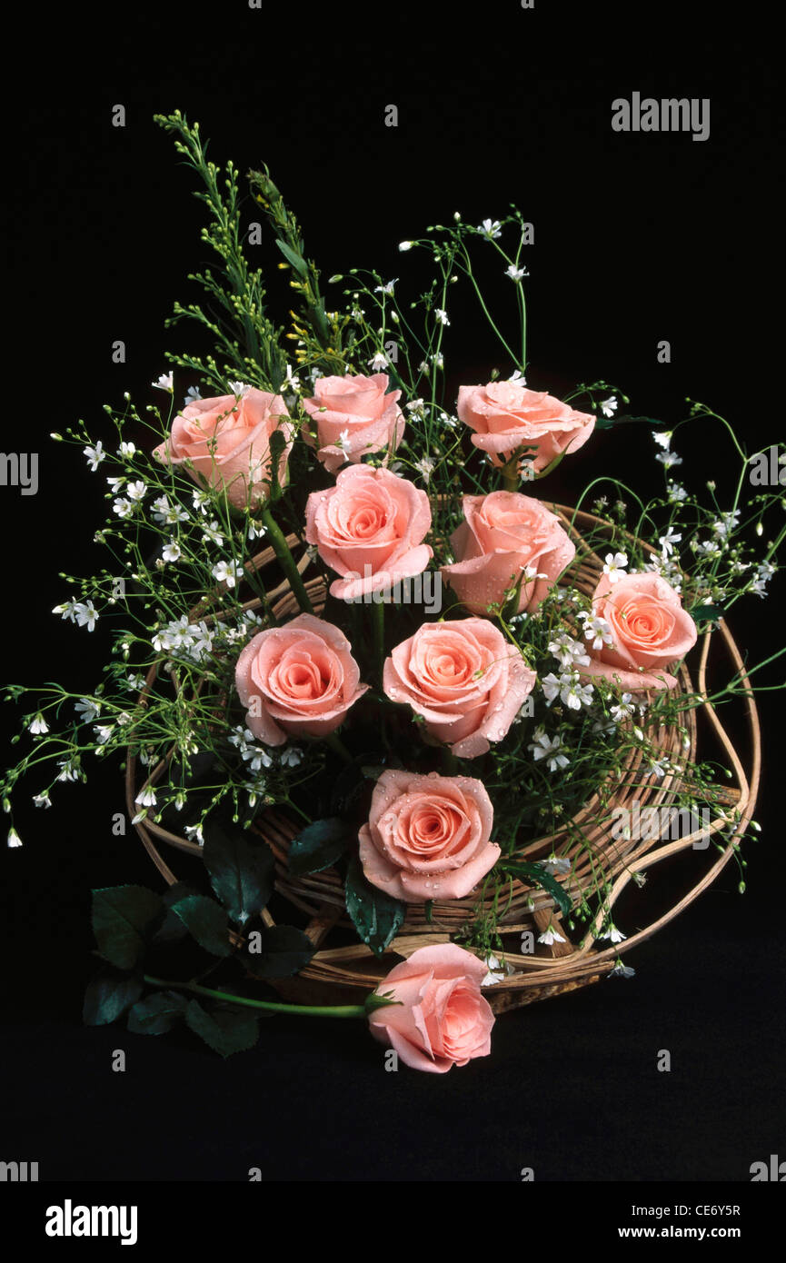 Bdr 86327 Artificial Flowers Arrangement Of Ten Pink Roses And Greens With Black Background Stock Photo Alamy