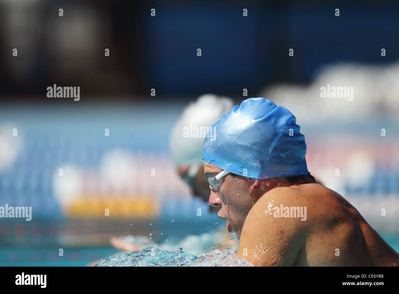 Swimmers Competing in Pool Stock Photo