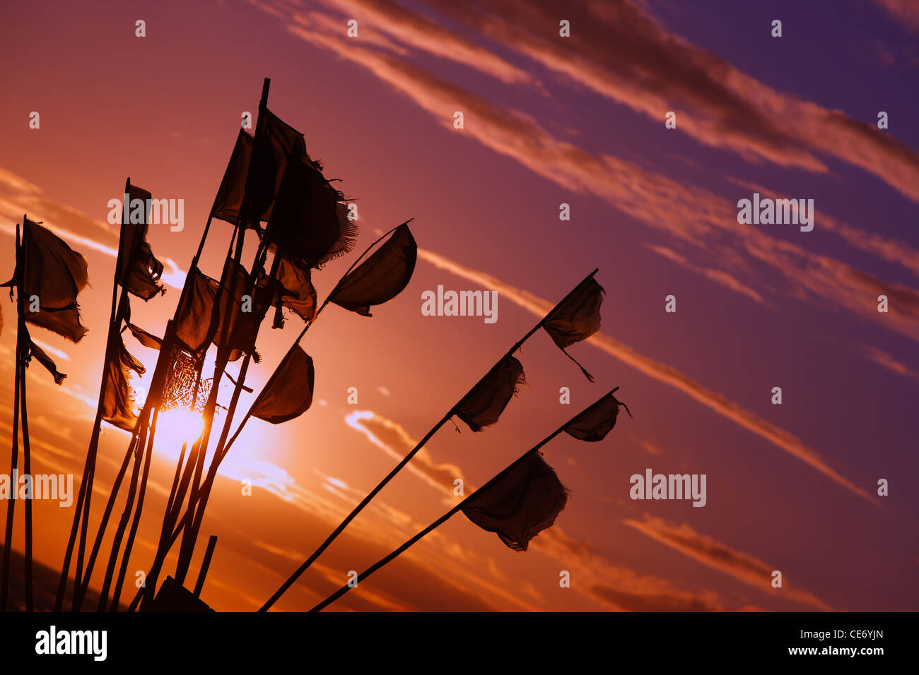 Fishermen flags against a sky at sunset. Stock Photo