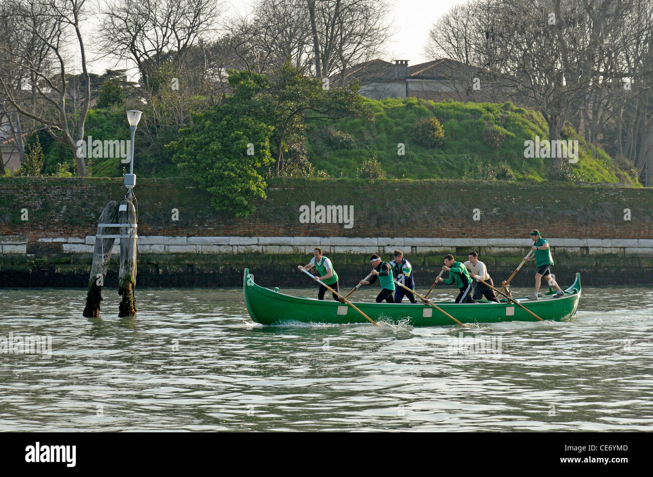 Six men rowing in gondola, practicing for the annual Venice Historical